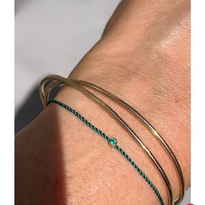 Solitaire emerald cord bracelet